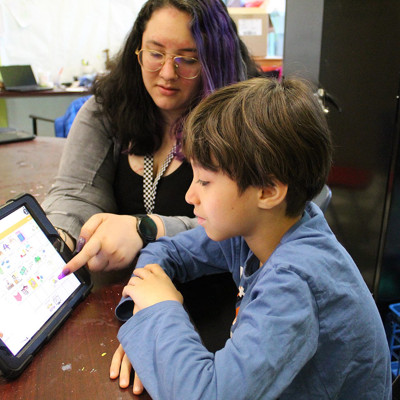 Teacher and Student with Assistive Device